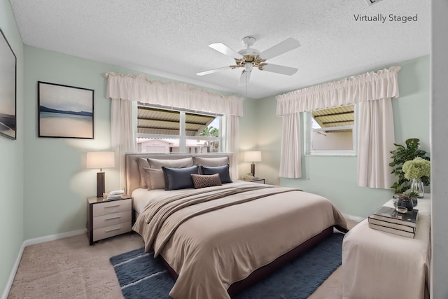 2078 SW 13th Ter, Boynton Beach, FL 33426 - bedroom with carpet, baseboards, a textured ceiling, and a ceiling fan