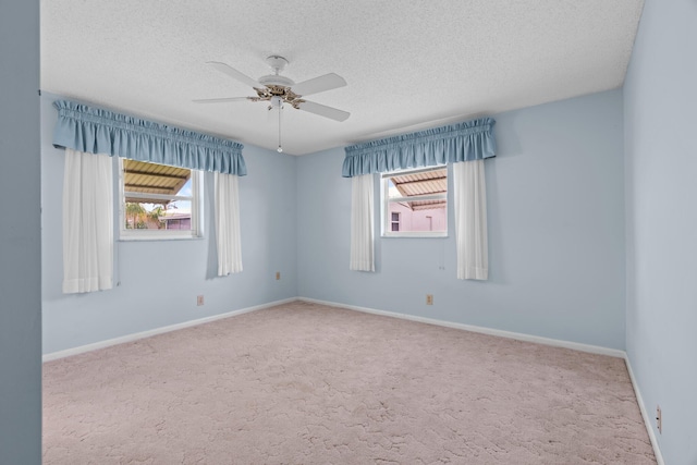 2078 SW 13th Ter, Boynton Beach, FL 33426 - empty room with plenty of natural light, ceiling fan, a textured ceiling, and carpet