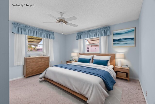 2078 SW 13th Ter, Boynton Beach, FL 33426 - carpeted bedroom featuring baseboards, a textured ceiling, and a ceiling fan