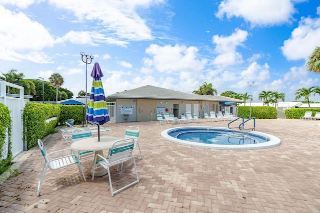 2078 SW 13th Ter, Boynton Beach, FL 33426 - view of swimming pool featuring a patio and a hot tub