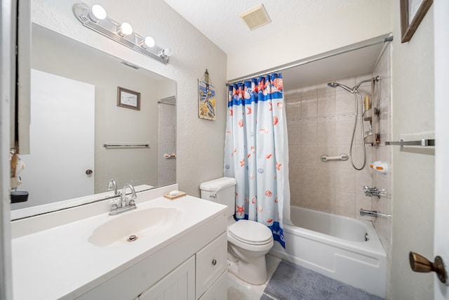 full bathroom with vanity, toilet, shower / tub combo with curtain, and a textured ceiling