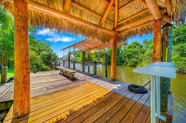 dock area with a gazebo and a water view