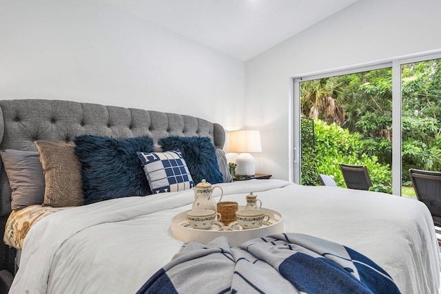 bedroom with lofted ceiling