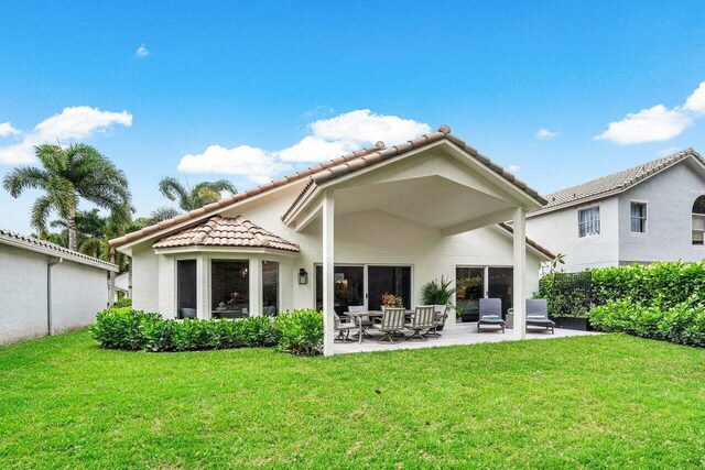 back of house with a patio, an outdoor hangout area, and a yard