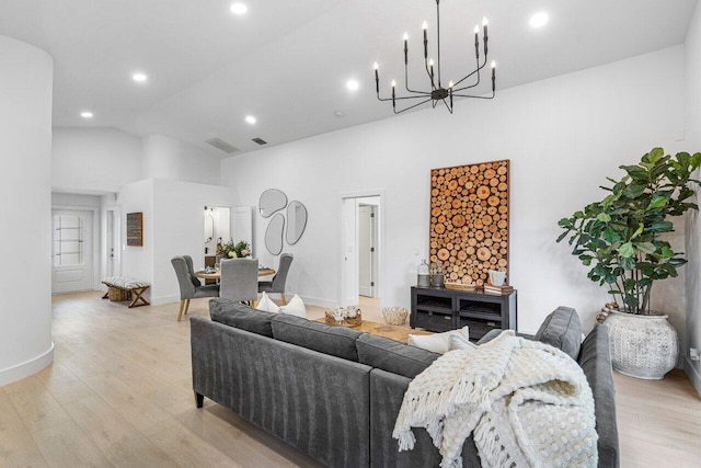 living room featuring light hardwood / wood-style flooring and high vaulted ceiling