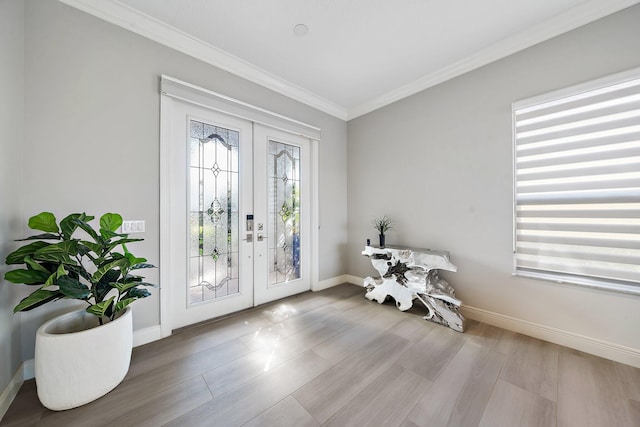 interior space with radiator, light hardwood / wood-style floors, crown molding, and french doors