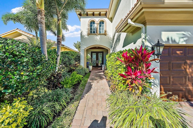 view of exterior entry featuring french doors