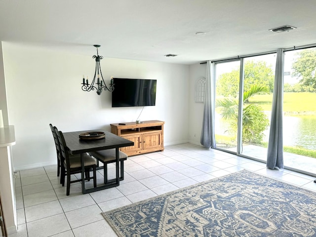 dining space featuring an inviting chandelier and light tile patterned floors