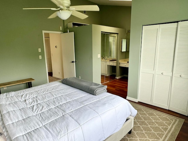 bedroom with vaulted ceiling, ceiling fan, and hardwood / wood-style floors