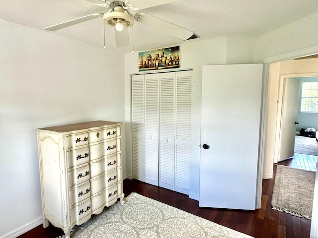 bedroom with ceiling fan, hardwood / wood-style flooring, and a closet