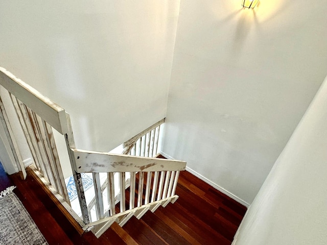 stairway featuring wood-type flooring