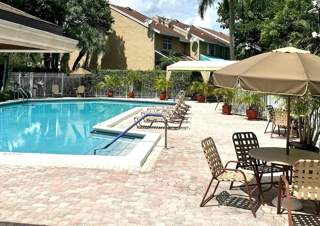 view of swimming pool featuring a patio area