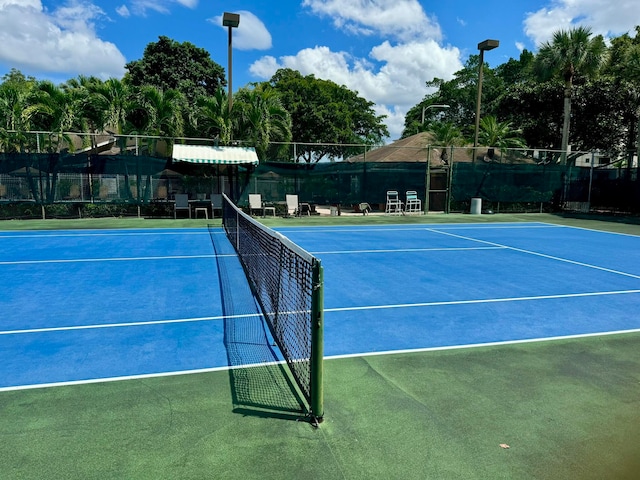 view of sport court with basketball hoop