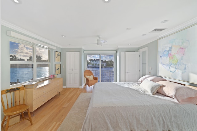 bedroom with access to exterior, ceiling fan, light wood-type flooring, and multiple windows