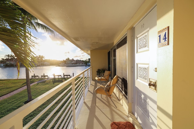 balcony featuring a water view