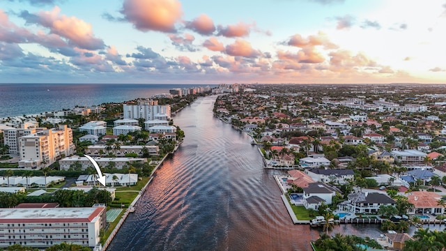 aerial view at dusk with a water view