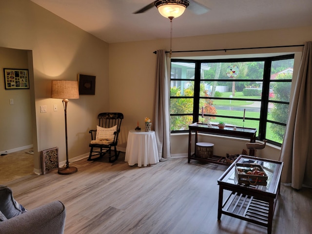 sitting room with wood finished floors, baseboards, and ceiling fan