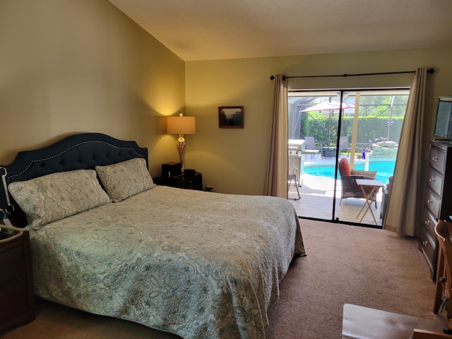 carpeted bedroom featuring lofted ceiling and access to outside