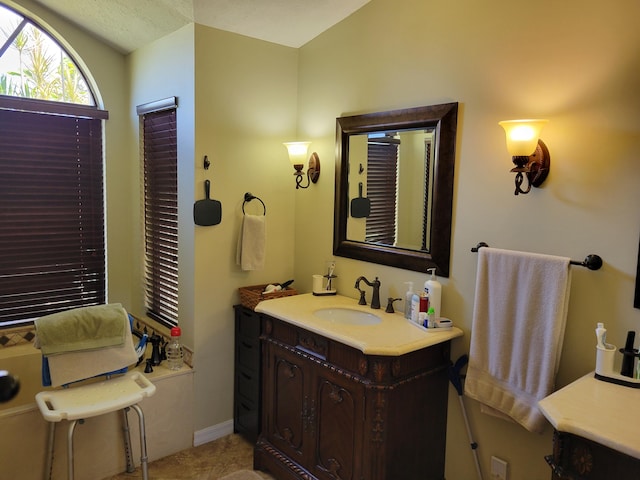 bathroom featuring tile patterned flooring and vanity