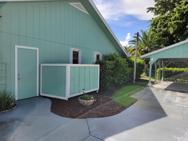 view of side of property featuring a patio