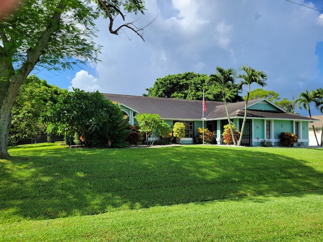 ranch-style home featuring a front yard