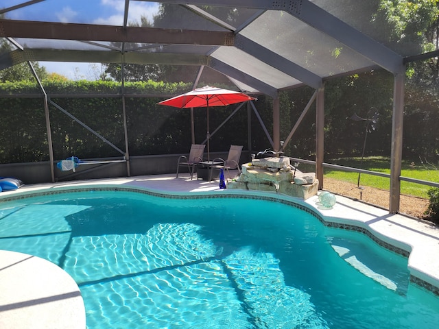 pool with a lanai and a patio