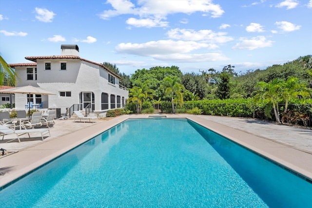 view of swimming pool with a patio