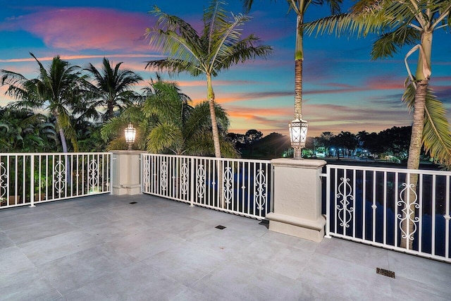 view of patio terrace at dusk