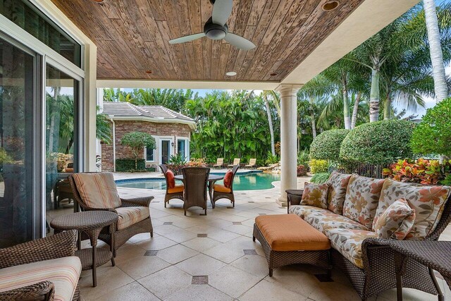 view of patio with outdoor lounge area and ceiling fan