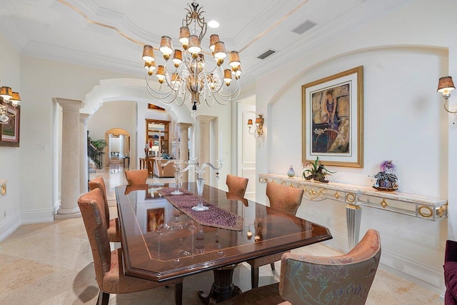 dining space featuring ornamental molding, a chandelier, and ornate columns