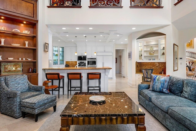 living room with a high ceiling