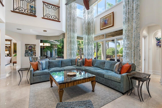 living room with a high ceiling