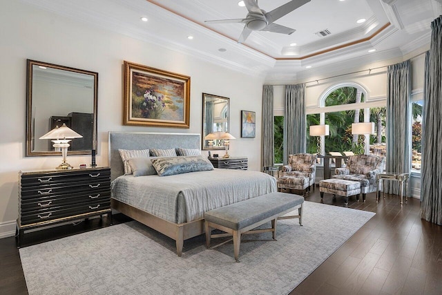 bedroom featuring ornamental molding, a raised ceiling, ceiling fan, and dark hardwood / wood-style floors