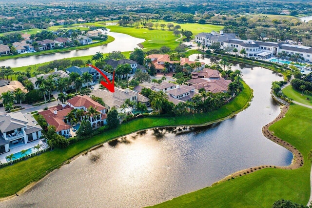 birds eye view of property featuring a water view