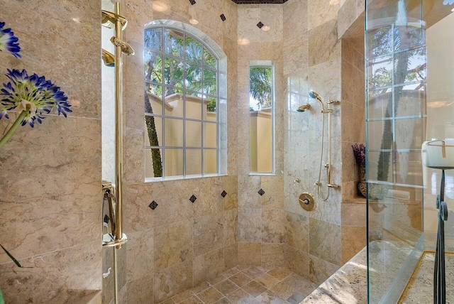 bathroom with tiled shower