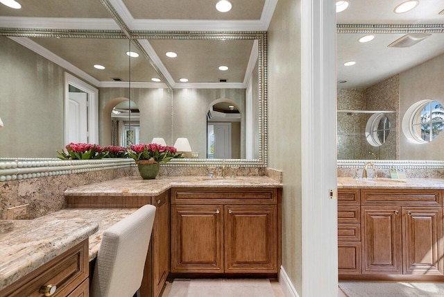 bathroom featuring ornamental molding, vanity, and a shower with door