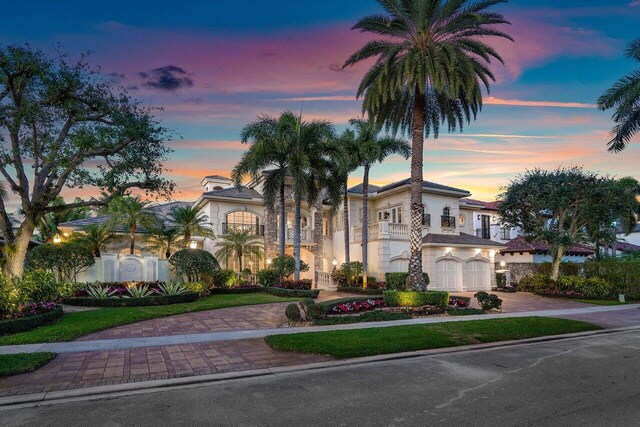 mediterranean / spanish house featuring a garage