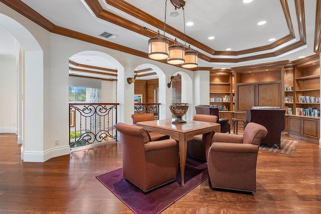 interior space featuring built in features, crown molding, and dark hardwood / wood-style floors