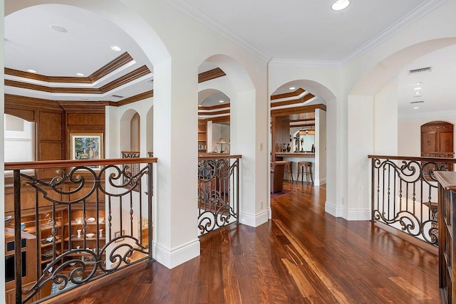 corridor featuring crown molding and dark wood-type flooring