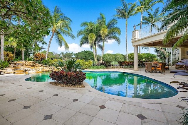 view of swimming pool with a patio