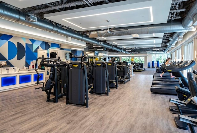 workout area with hardwood / wood-style flooring