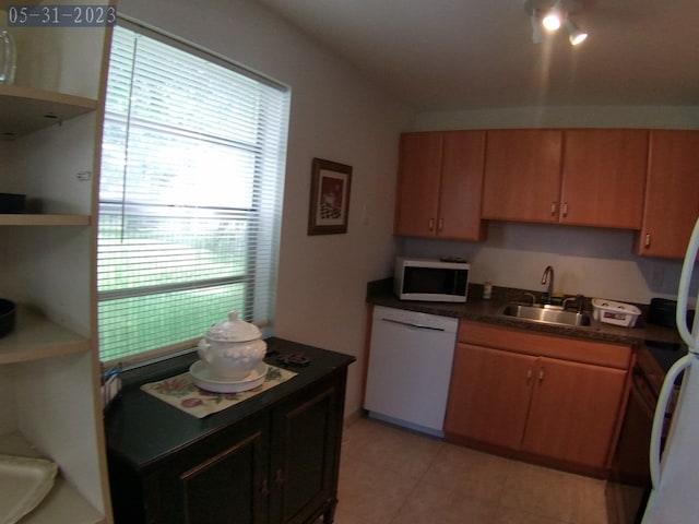 kitchen featuring sink and white appliances