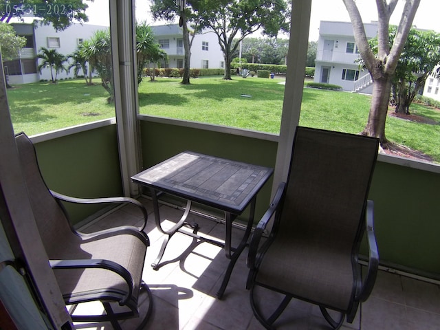 sunroom / solarium featuring a healthy amount of sunlight