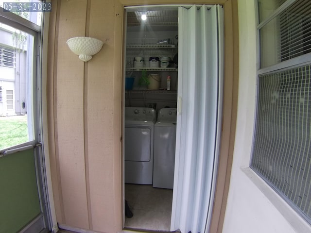 laundry area with independent washer and dryer