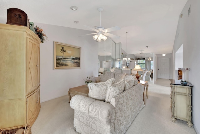 7618 Tahiti Ln Unit 201, Lake Worth, FL 33467 - living room featuring light colored carpet, a ceiling fan, and a chandelier