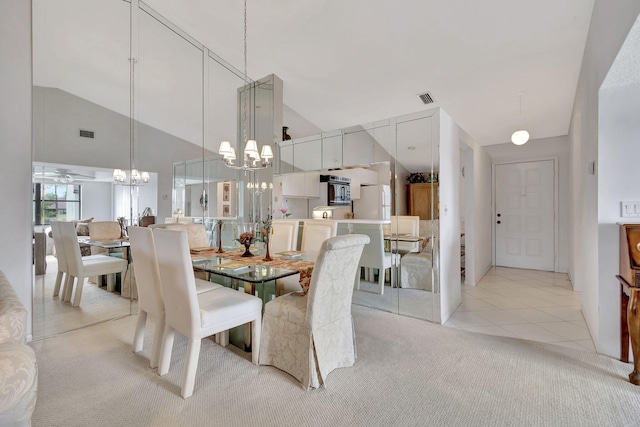 tiled dining space featuring high vaulted ceiling and ceiling fan