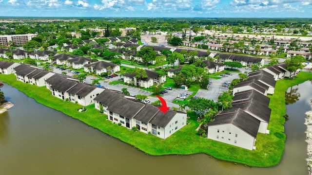 birds eye view of property featuring a residential view and a water view