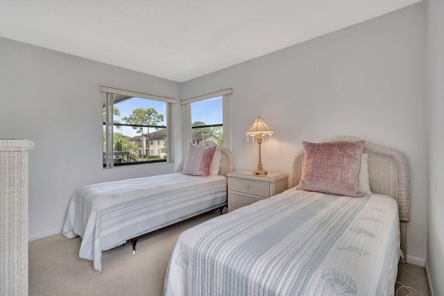 bedroom featuring baseboards and carpet floors