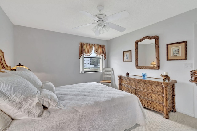 bedroom with light carpet, baseboards, and ceiling fan