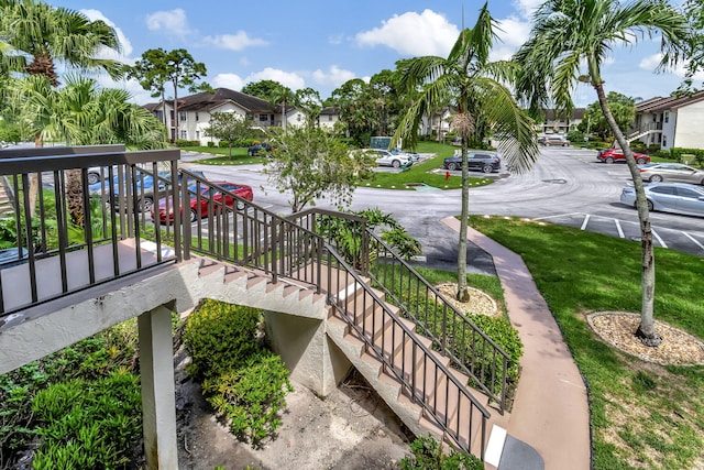 exterior space featuring uncovered parking and a residential view